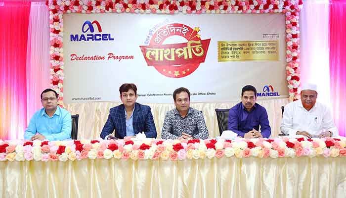 Marcel’s higher officials pose for a photograph while attending the ‘Offer Declaration Programme’ at the conference room of the company’s corporate office in the capital on Tuesday